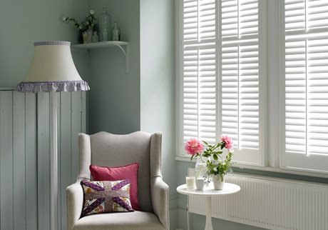 White wooden window shutters