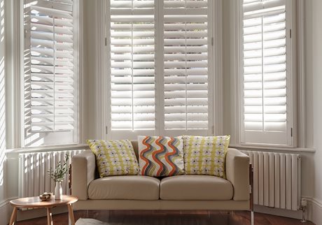 White window shutters in living room