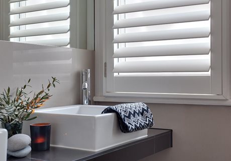 White window shutters in bathroom