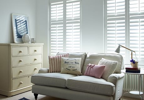 white shutters in neutral living room