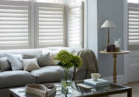 white shutters with grey sofa